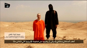 An ISIS fighter executing a man in Iraq